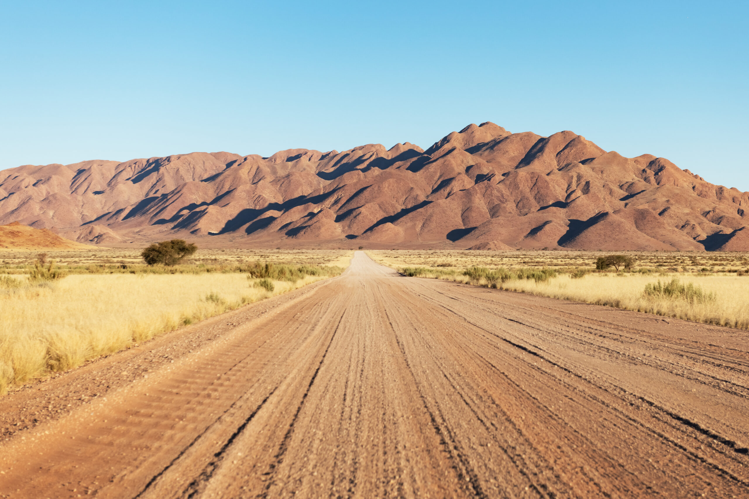 Gravel road and beautiful landscape with sunset sky